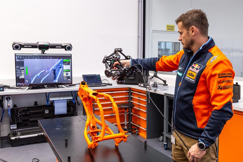 Quality Controller Motorsport Christian Schwarz performs 3D scanning of the motorcycle frame